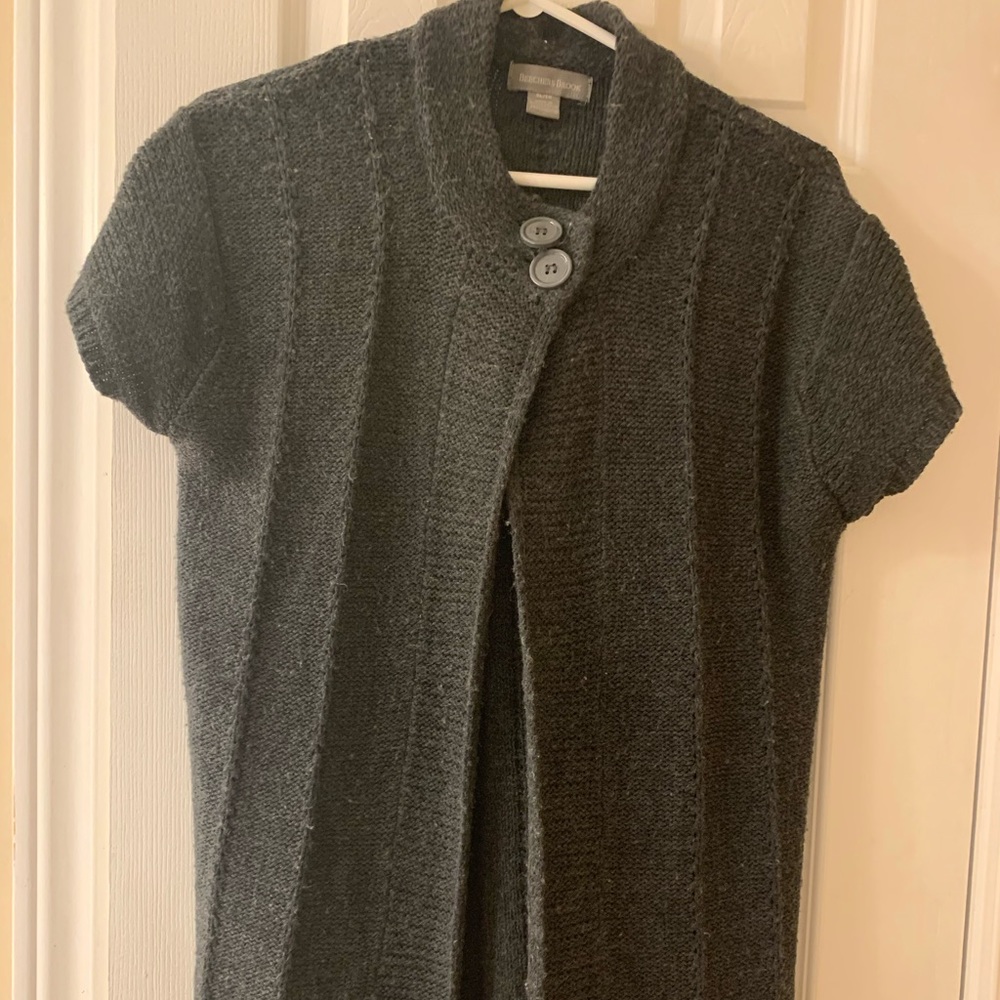 Long sweater with 2 buttons at collar.